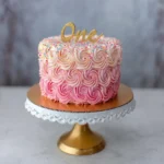 Smash cake with colorful frosting and sprinkles